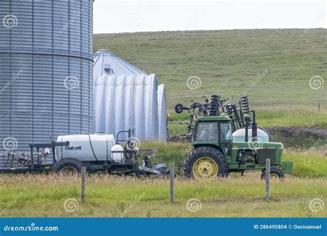An Agriculture Tractor Towing a Pesticide Container at a Farm Editorial Stock Image - Image of ...