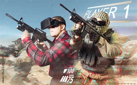 Vr gamer playing war game and aiming automatic rifle with fully ...