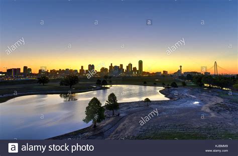 Downtown Dallas skyline at sunrise in Texas, USA from the Trinity River ...