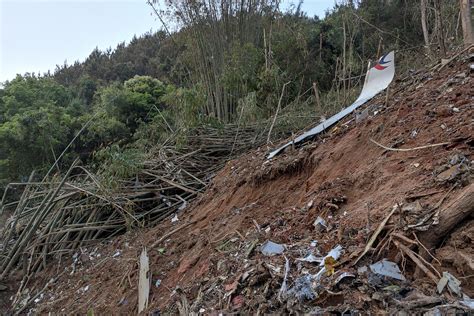 Chinese airliner crashes with 132 aboard in country's south | AP News