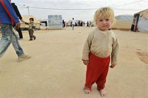 A Syrian boy at a Al-Zaatri refugee camp in Jordan | European people, People with blue eyes, Refugee