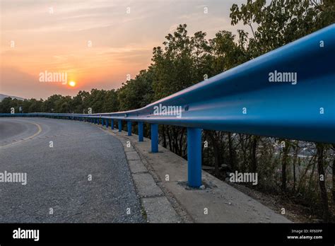 mountain road with sunset background Stock Photo - Alamy