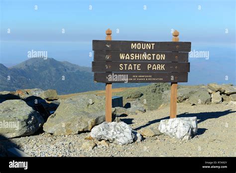 Mount Washington State Park sign in fall with foliage from summit of Mount Washington, White ...