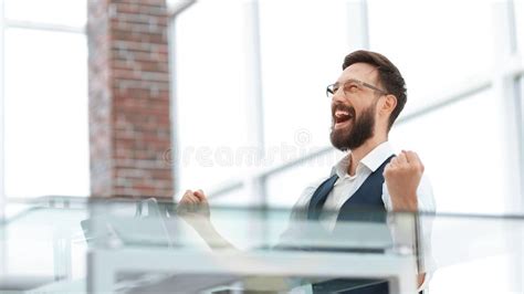 Very Happy Businessman Sitting at the Office Desk Stock Photo - Image of positivity, manager ...