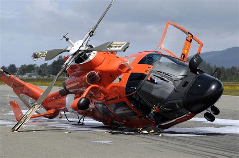 A U.S. Coast Guard MH-65 Dolphin helicopter lays its side after crashed Arcata Airport during a ...