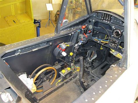 the inside of an airplane cockpit with many wires