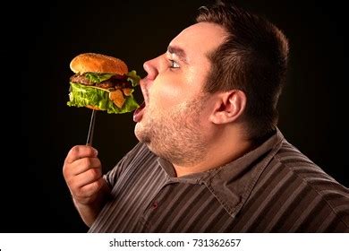 Black Background Man Hamburger Puzzled Look Stock Photo 1662057733 ...