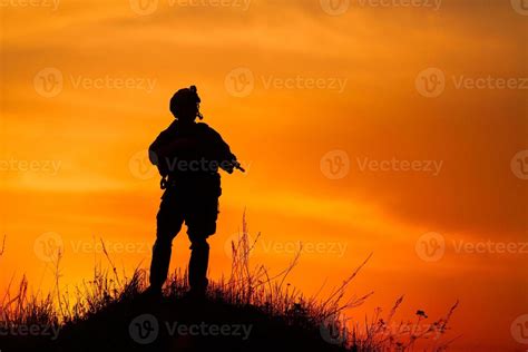 Silhouette of military soldier or officer with weapons at sunset ...