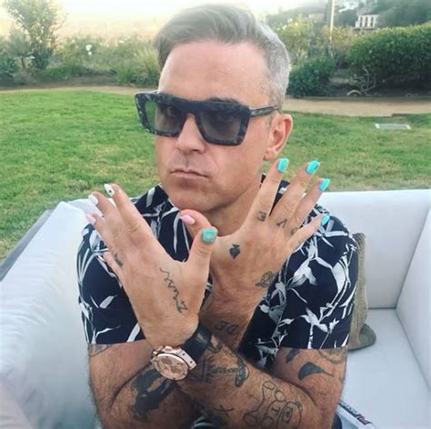 Robbie Williams tattoos: From two pairs of glasses to matching with ...