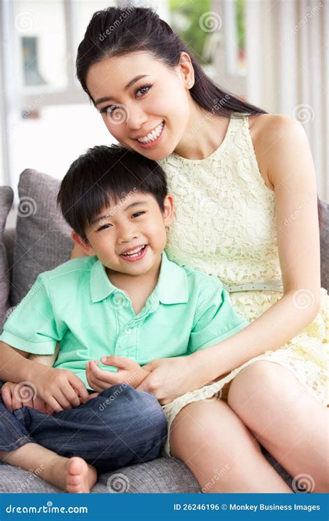 Chinese Mother and Son at Home Together Stock Photo - Image of indoors, lounge: 26246196