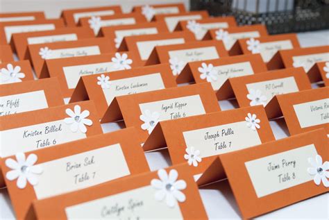 DIY name cards/table seating for wedding in orange. Printed the names in pearl sheen paper and ...