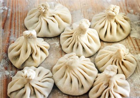 Chinese Dumplings Uncooked on Wooden Background. Street Food Booth ...