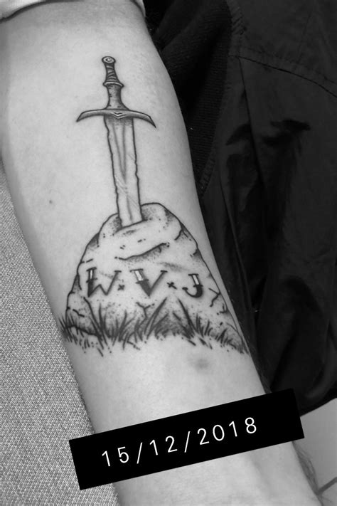 The Excalibur In Stone Tattoo