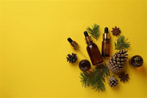 Premium Photo | Aromatherapy concept with pine oil on yellow