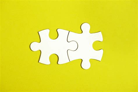 Two Connected Jigsaw Puzzle Pieces Stock Photo - Download Image Now - iStock