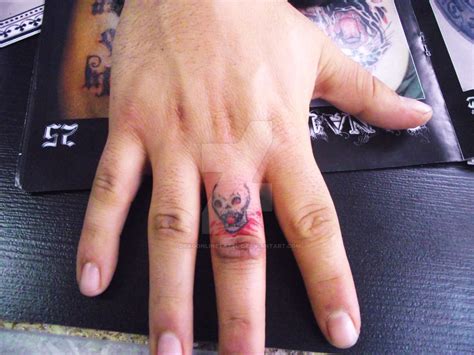 skull ring tattoo by dragonlinetattoo on DeviantArt