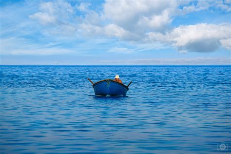 Fisherman in Small Boat in the Sea Background - High-quality Free Backgrounds