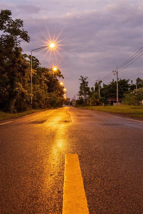 A view of the light from the long-exposure orange street lamps creating ...