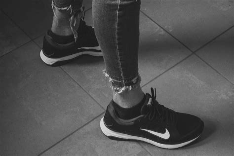 Person in Black Nike Running Shoes · Free Stock Photo