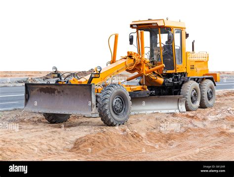 Road grader - heavy earth moving road construction equipment Stock Photo - Alamy