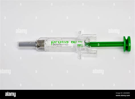 Denosumab osteoporosis drug. Syringe containing the monoclonal antibody drug denosumab, marketed ...