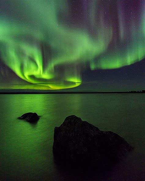 The northern lights over Ennadai Lake in Nunavut, Canada. By John E ...