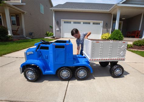 This rideable toy semi truck has a 'CB' and a detachable trailer and ...