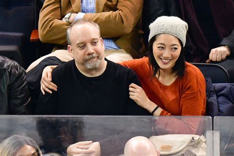 Paul Giamatti and mystery woman attend Rangers game