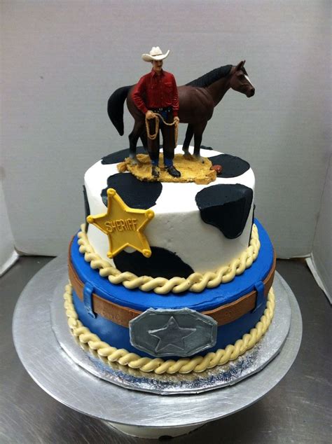 a birthday cake with a cowboy on top