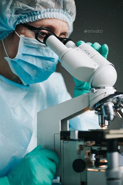 Scientist working in laboratory with microscope | Medical laboratory scientist, Medical ...