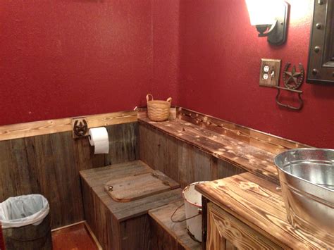 Our rustic bathroom. The paint is cabin red valspar from lowes. We put in a low profile toilet ...