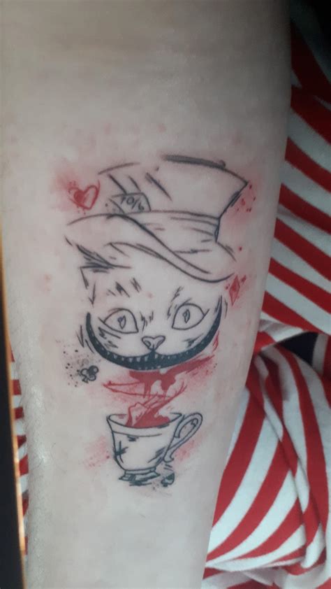 Got a cheshire cat tattoo today! : r/aliceinwonderland