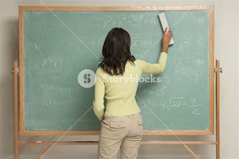 Student erasing chalkboard Royalty-Free Stock Image - Storyblocks