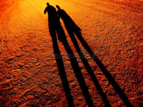 Shadow of People Holding Hands Walking on Pathway Stock Photo - Image of romance, happy: 207140956