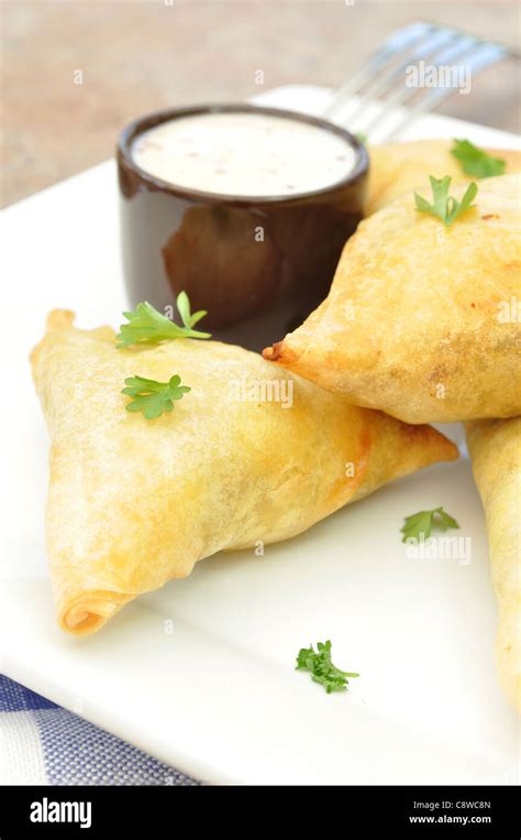 Mini feta and spinach phyllo triangles Stock Photo - Alamy