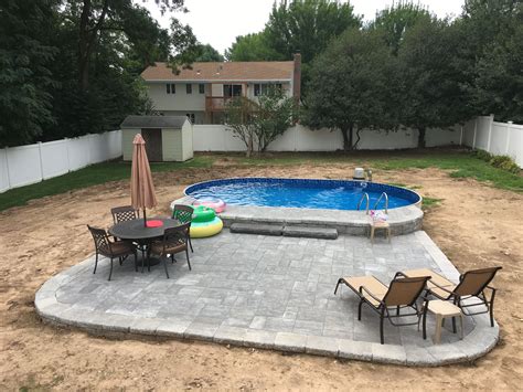 Wilbar optimum semi in-ground pool with raised patio | Backyard pool ...