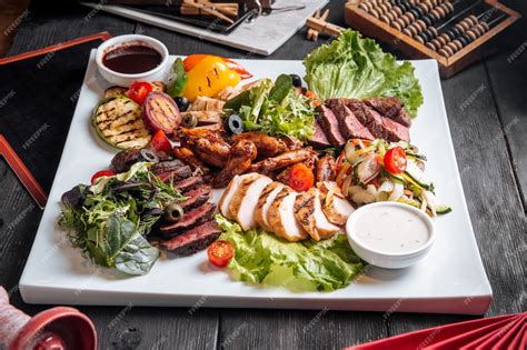 Premium Photo | Assorted grilled meat platter with beef chicken