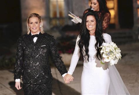 Newlyweds Ali Krieger and Ashlyn Harris make their way back up the ...