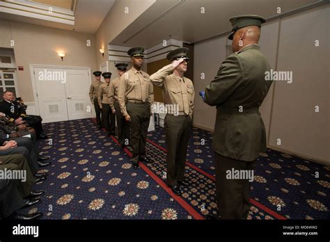 U.S. Marines with Headquarters Marine Corps, Manpower and Reserve affairs, perform Old Glory ...