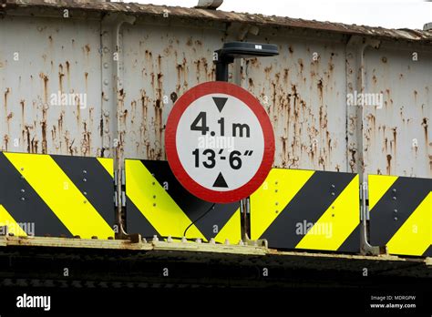 Railway bridge height restriction sign, Castle Vale, Birmingham, UK Stock Photo - Alamy