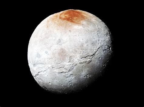 How Pluto's Moon Charon Got Its Dusty Red Cap | WIRED