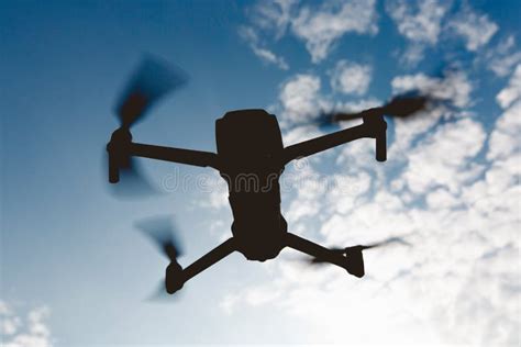 Black Silhouette of a Foldable Drone Flying in the Sky. Stock Photo - Image of accessory, drone ...