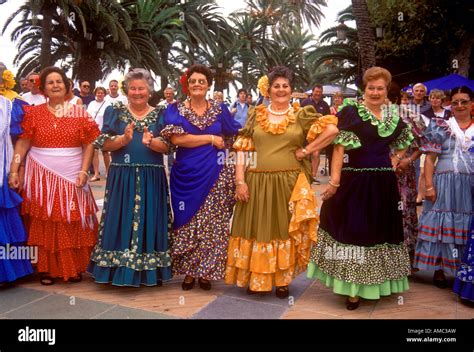 Women in traditional Spanish costume worn at a typical fiesta in the ...