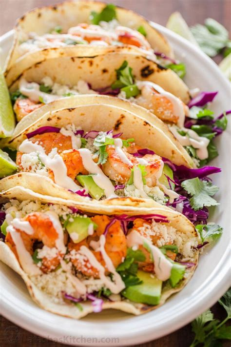 Shrimp Tacos are loaded with shrimp, cabbage, avocado, cotija, cilantro and served over gluten ...