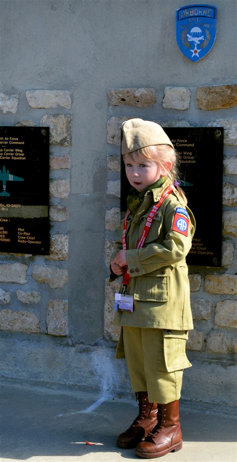 A French girl, dressed in a U.S. Army 82nd Airborne Division vintage ...