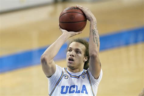 UCLA player arrested after allegedly spitting at Arizona fan | AP News