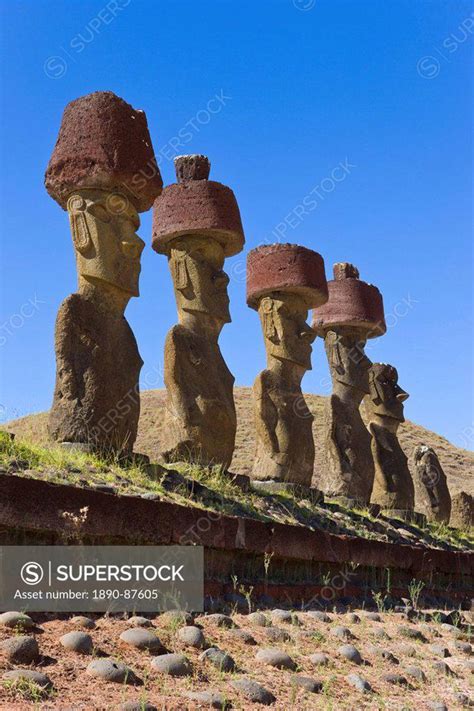 Anakena beach, monolithic giant stone Moai statues of Ahu Nau Nau, four of which have topknots ...