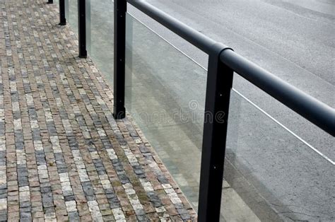 Safety Railings on the Sidewalk Protect People from Falling into the Traffic Road. Railings are ...