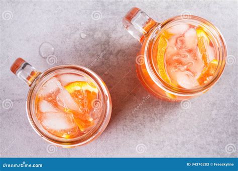 Campari and Vermouth Cocktail with Oranges, Garnished with Thyme. Stock Image - Image of ...