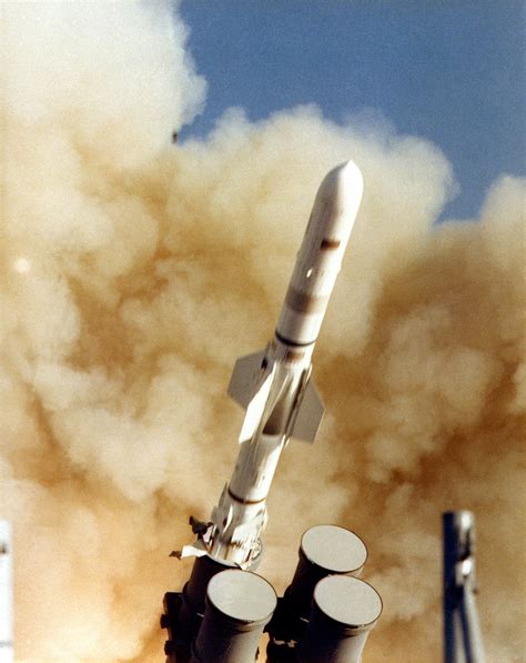 A view of an RGM-84 Harpoon missile being launched from a canister launcher aboard the cruiser ...